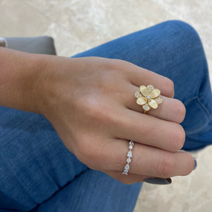 Female Model Wearing Diamond and Brushed Gold Flower Cocktail Ring - 18K gold weighing 6.79 grams  - 21 round diamonds weighing 0.24 carats