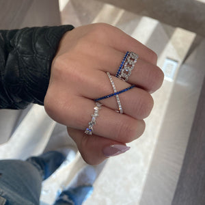 Female model wearing Baguette and Round Diamond Urban Stacking Ring - 18K white gold weighing 2.11 grams - 7 round diamonds weighing 0.28 carats - 12 slim baguettes weighing 0.33 carats