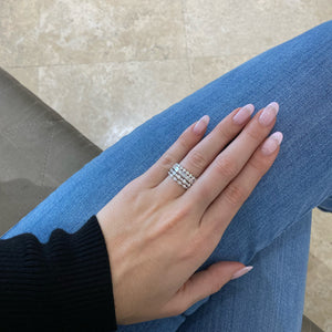 Female model wearing Single-Prong Diamond Eternity Ring- 18K white gold weighing 1.65 grams - 23 round diamonds weighing 1.15 carats