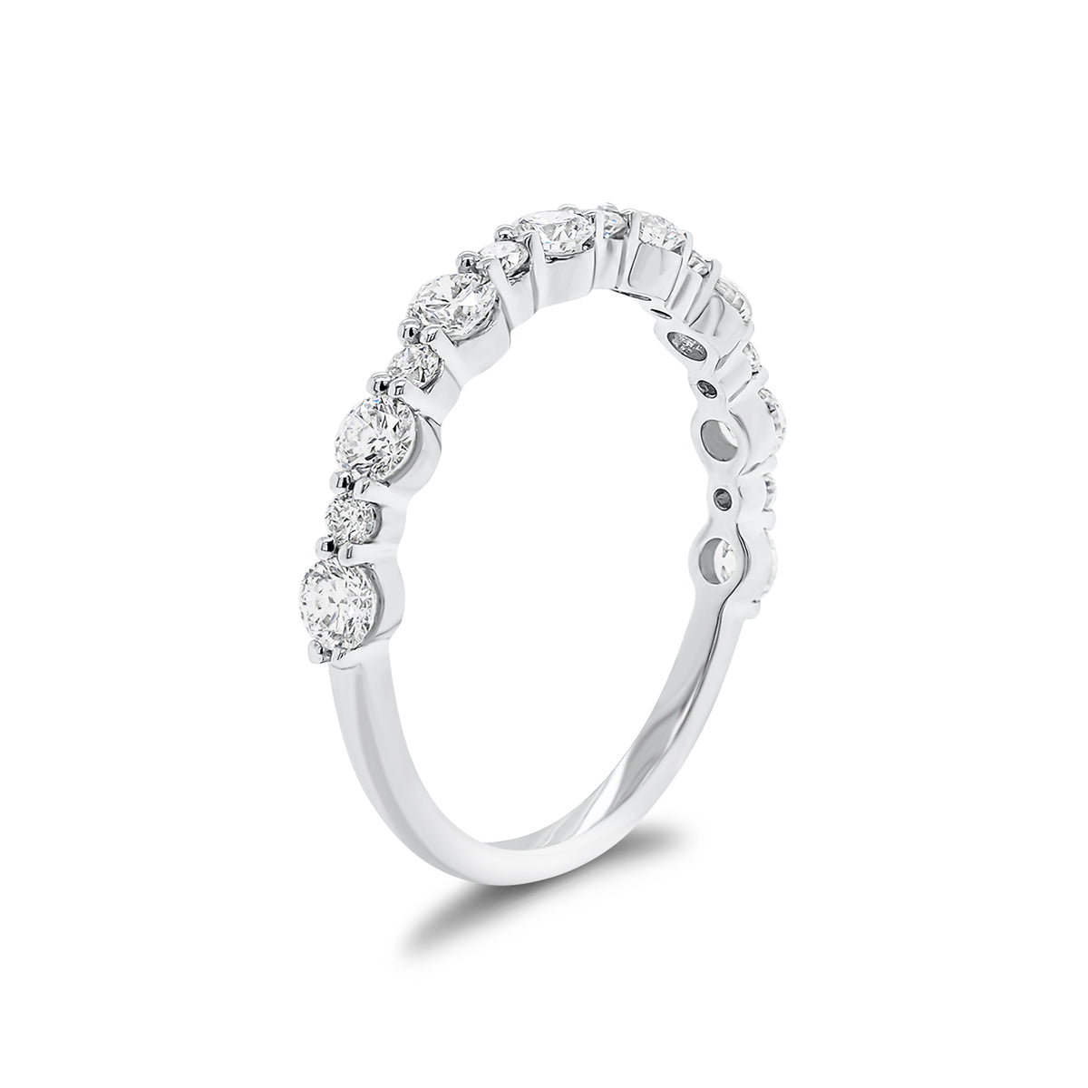 Diamond Pattern Wedding Band - 14K gold weighing 1.44 grams  - 8 round diamonds weighing 0.56 carats  - 7 round diamonds weighing 0.13 carats