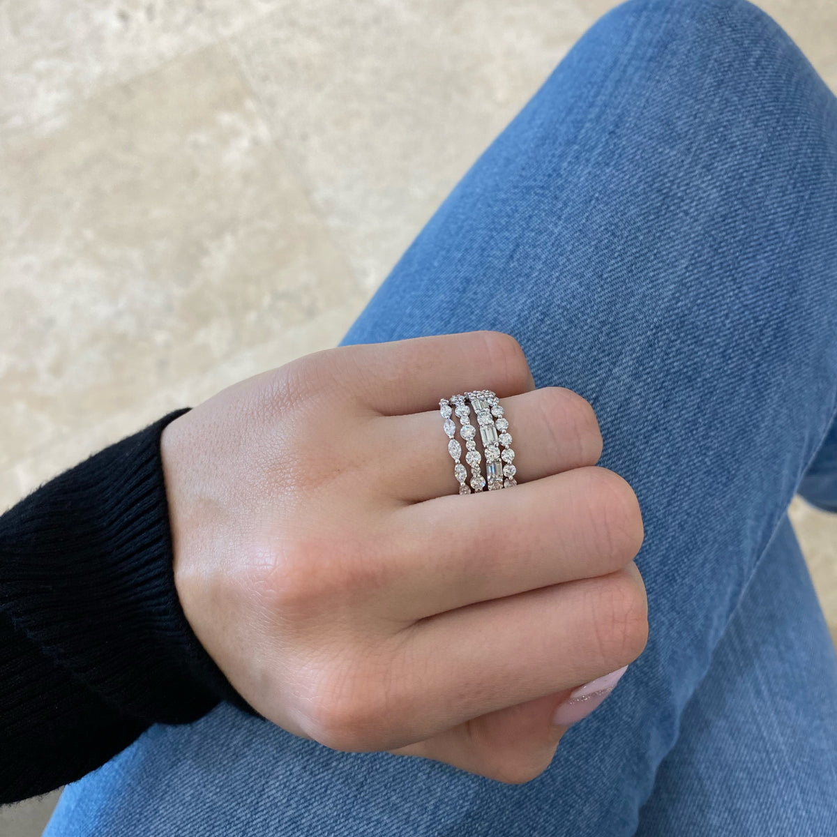 Female model wearing Diamond Pattern Wedding Band - 14K gold weighing 1.44 grams - 8 round diamonds weighing 0.56 carats - 7 round diamonds weighing 0.13 carats