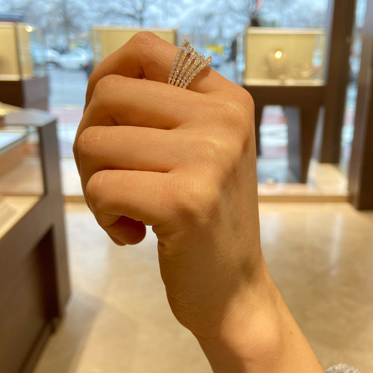 Female Model Wearing Graduated Diamond Multi-Band Ring  - 18K gold weighing 7.79 grams  - 93 round diamonds totaling 2.01 carats