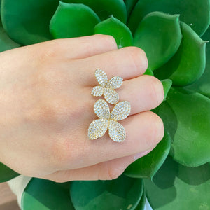 Female Model Wearing Diamond Flower Duo Ring  - 14K gold weighing 8.06 grams.  - 265 round diamonds totaling 1.96 carats. 
