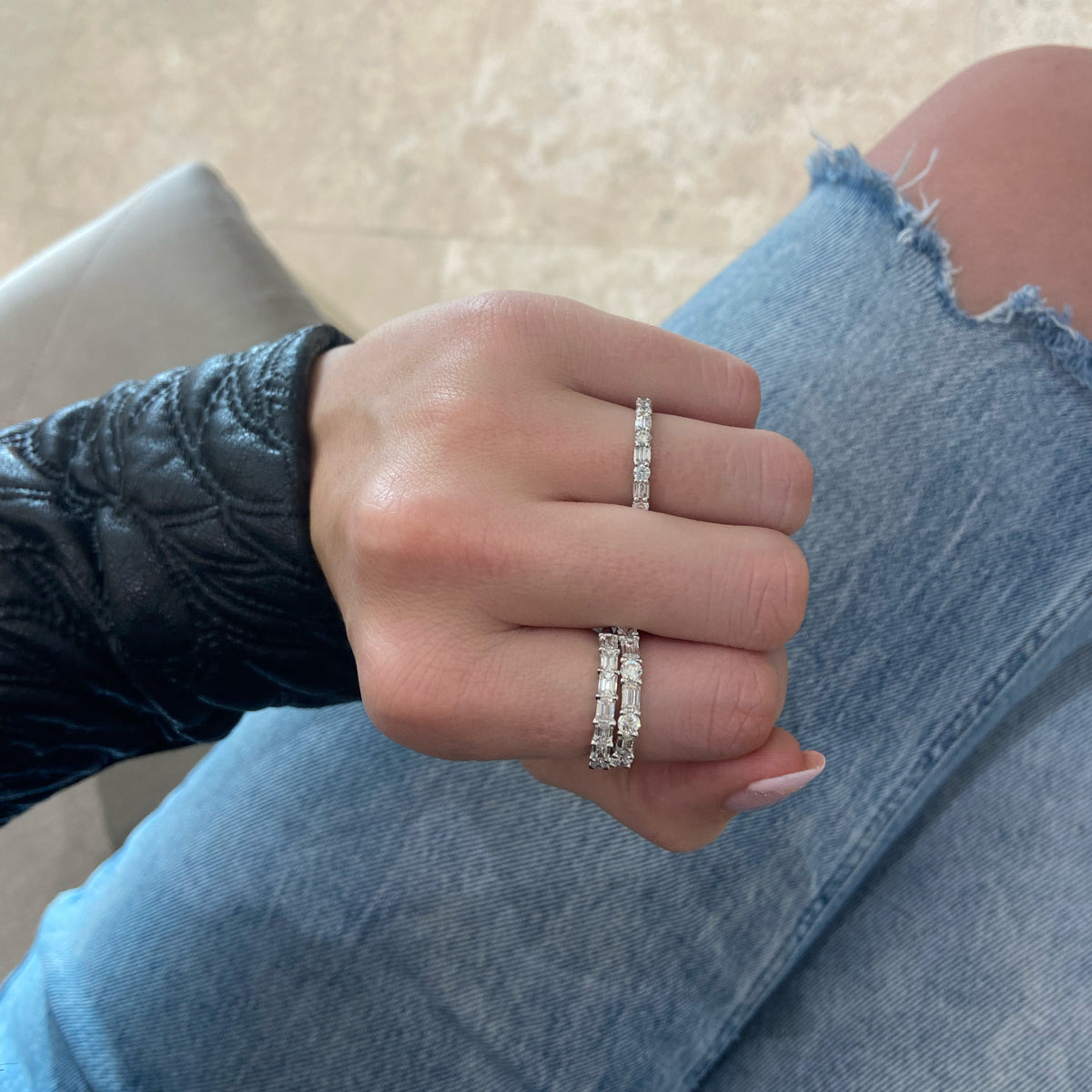 Female model wearing Round and Double Baguette Diamond Wedding Band - 18K gold weighing 2.78 grams - 10 slim baguettes weighing 0.38 carats - 4 round diamonds weighing 0.31 carats