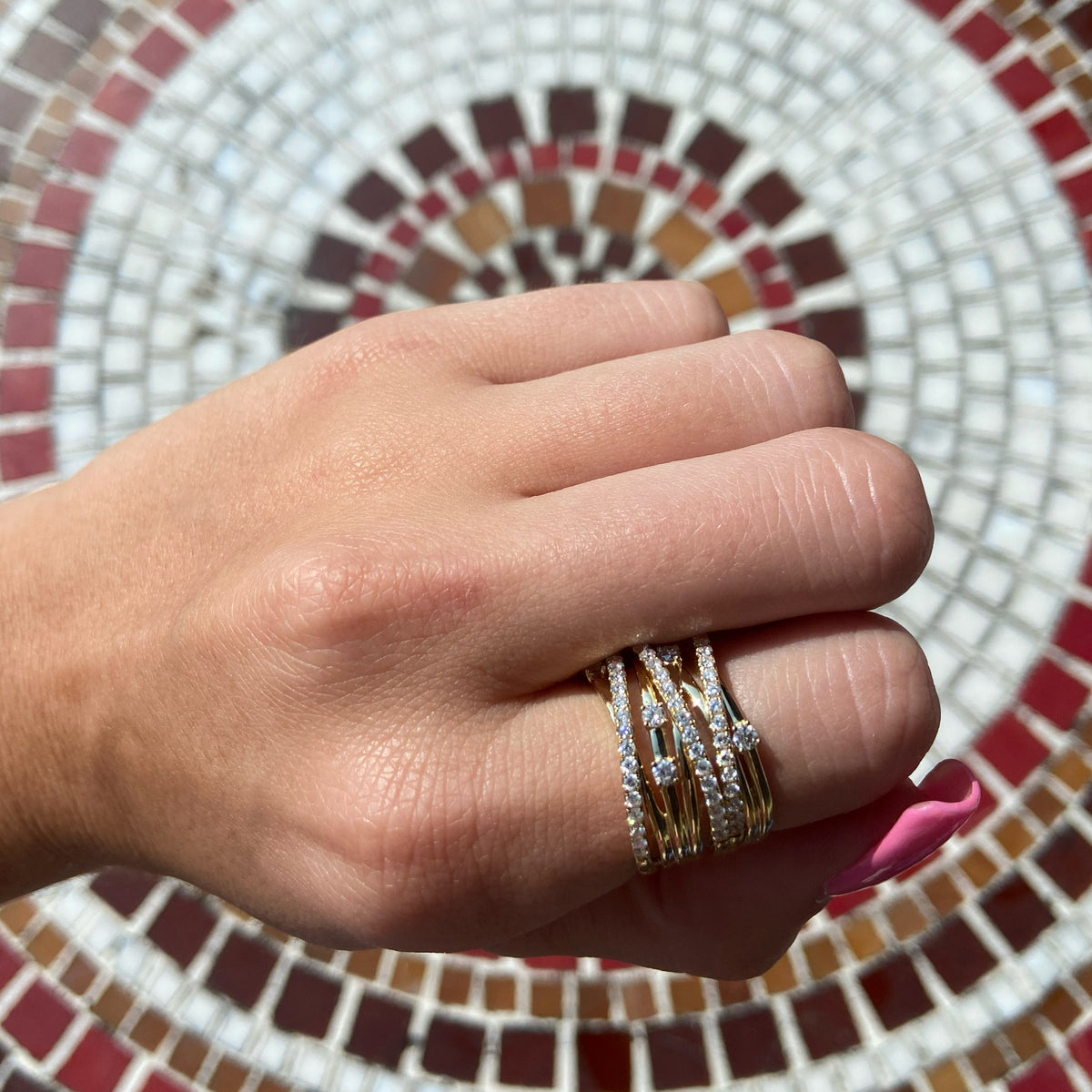 Female Model Wearing Diamond & Gold Multi-Band Ring  - 18K gold weighing 11.0 grams  - 69 round diamonds totaling 1.04 carats