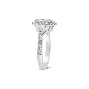 Three-Stone Elongated Radiant-Cut Diamond Engagement Ring  - 18KT white gold weighing 4.2 grams.  - 34 Round diamonds totaling .43 carats