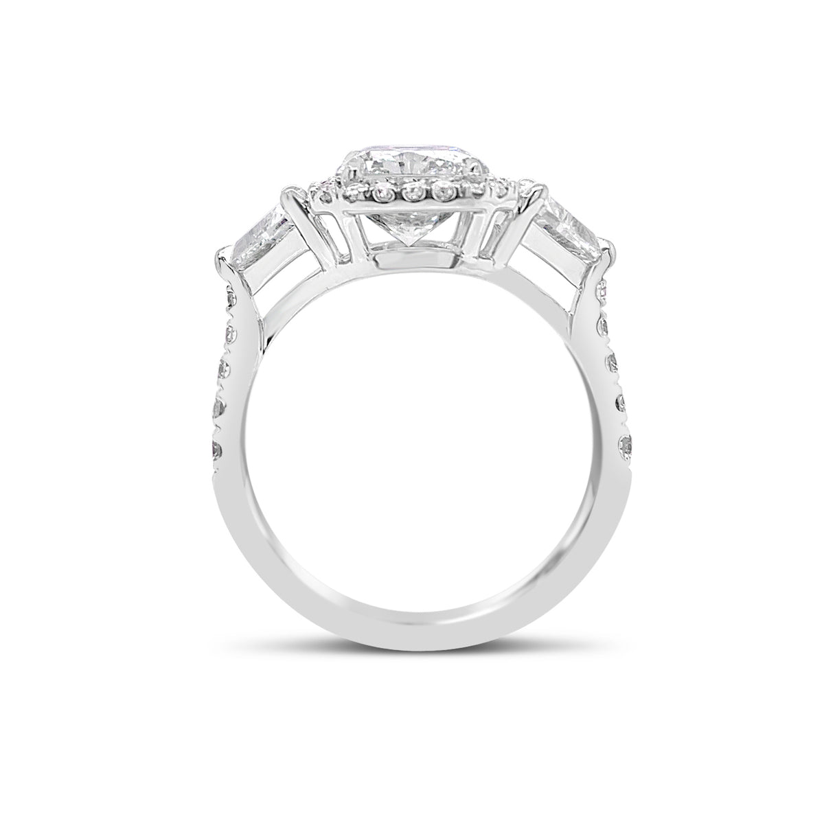 Three-Stone Elongated Radiant-Cut Diamond Engagement Ring  - 18KT white gold weighing 4.2 grams.  - 34 Round diamonds totaling .43 carats
