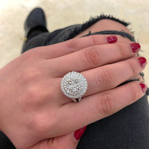 Female Model Wearing Circular Diamond Cluster Engagement Ring  -18k gold weighing 10.51 grams  -79 round diamonds weighing 2.36 carats