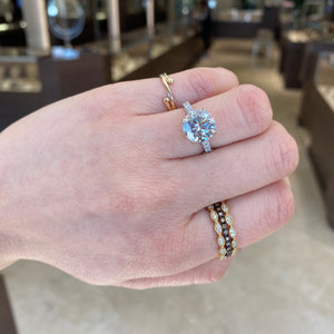 Female Model Wearing Diamond Stackable Ring with Milgrain  - 18K gold weighting 2.11 grams.  - 18 round diamond totaling .21 carats. 