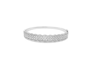 Diamond Two-Tone Bangle Bracelet -18K white gold weighing 20.63 grams -52 round diamonds totaling 2.90 carats -157 pave diamonds totaling 1.33 carats