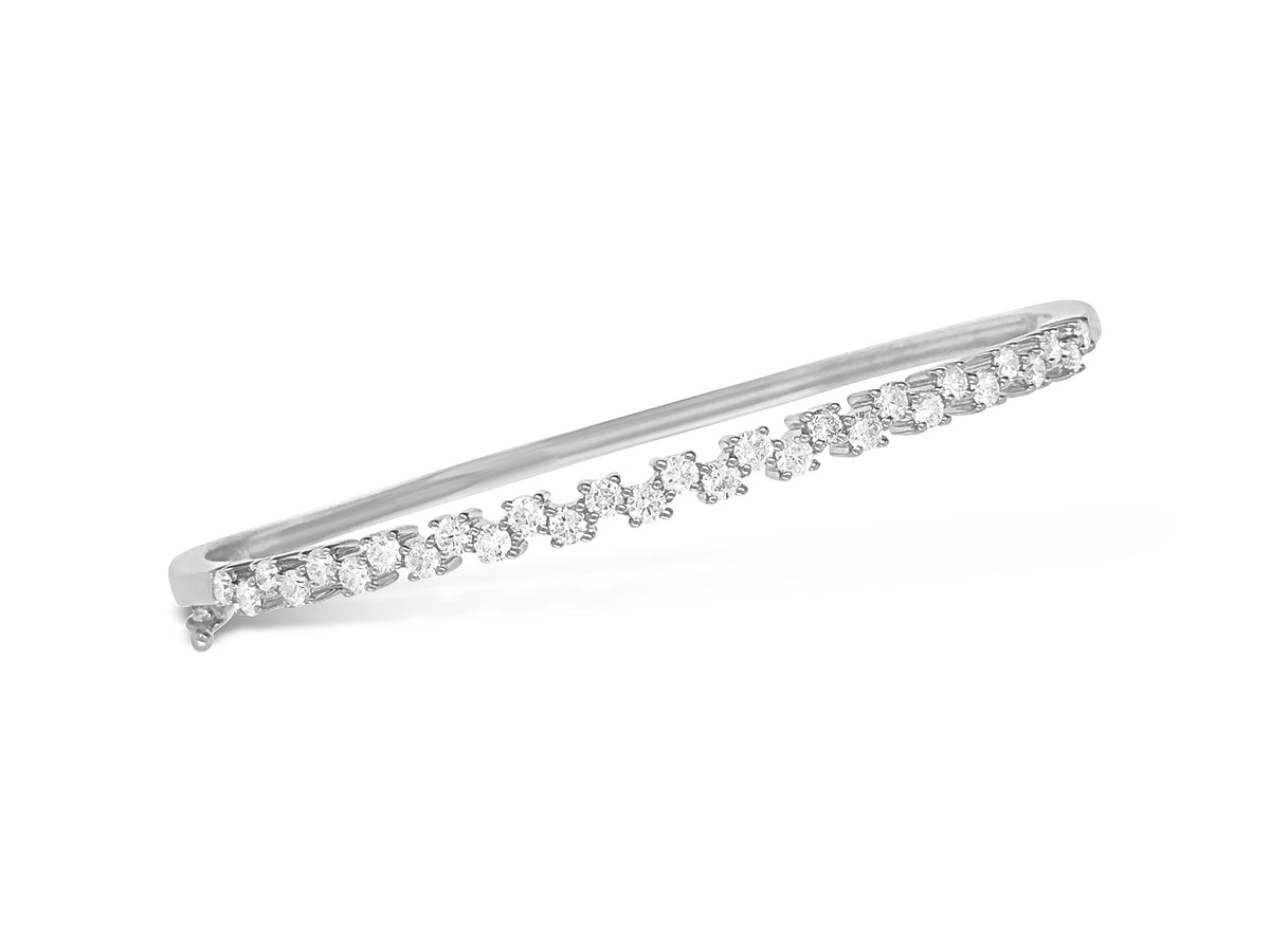 Diamond Zig-Zag Bangle Bracelet  -14K gold weighing 9.50 grams  -29 round diamonds totaling 1.00 carat